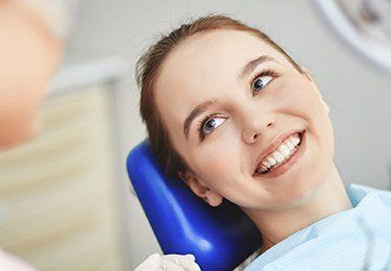 Smiling woman in exam chair