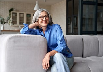 a woman smiling with dentures in Melbourne