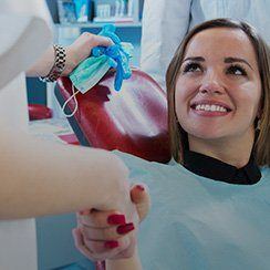 Woman in dental chair smiling