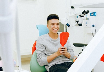 Man smiling in dental chair