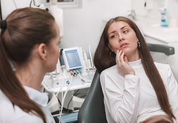 a person showing their emergency dentist in Melbourne where they have pain