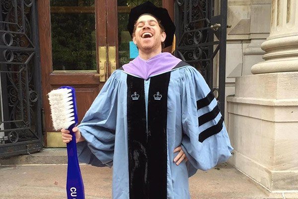 Dr. Derek Chenet in graduation outfit