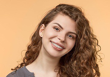 Young woman with traditional braces