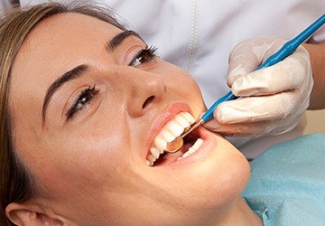 Woman receiving dental exam