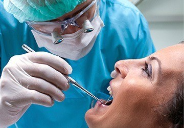 Woman receiving oral cancer screening