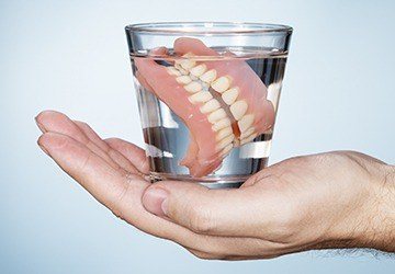 Full dentures in glass of water