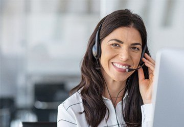 smiling woman with phone headset