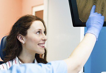 Woman looking at x-rays