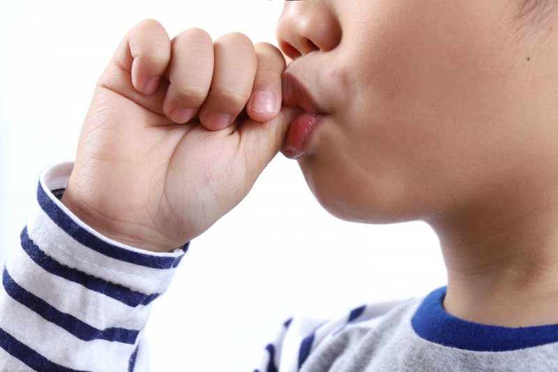 Close up of a child sucking their thumb
