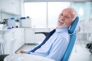 older man receiving dental implants