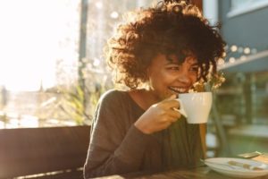 Woman drinking a cup of coffee.